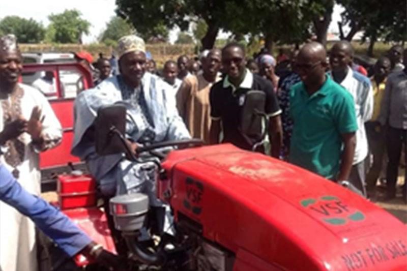A community leader in Gombi LGA receives a power tiller, dry season farming support, 2018